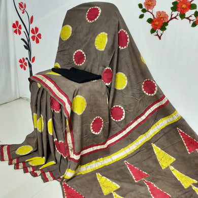 Brown Mulmul Saree with Yellow and Red Designs